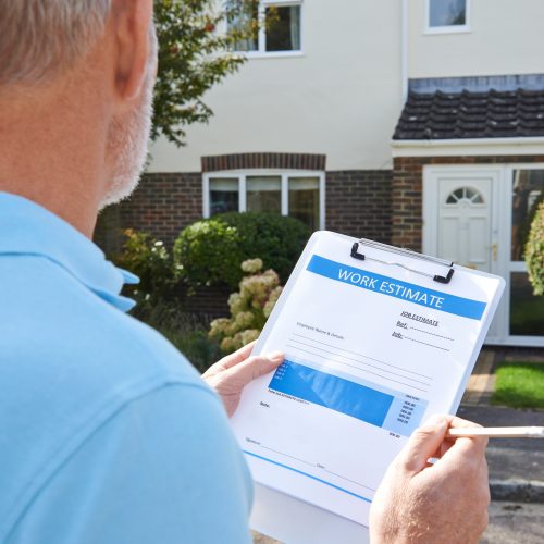 Contractor reviewing an exterior project estimate